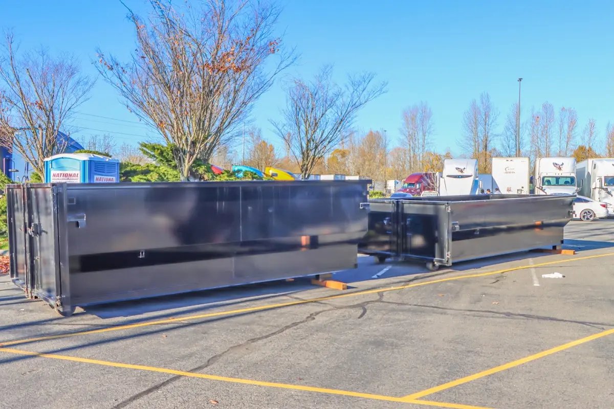 Professional dumpster rental service with roll-off container on residential driveway in Jennings Lodge